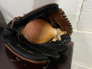 Onion in baseball glove